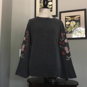Sweater with embroidered sleeves